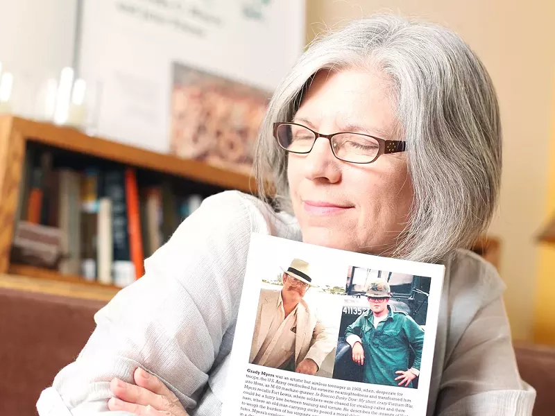 Julie Titone with a copy of Boocoo Dinky Dow, her late ex-husband’s war memoir. - YOUNG KWAK