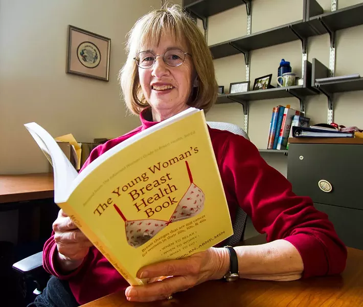 Kerry Anne McGinn with the latest edition of her book: Even knowing that having breast pain does not mean you have breast cancer is... very reassuring. - STEPHEN SCHLANGE