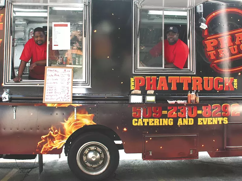 LeSean Grant (left) and Avont Grant slinging burgers on Sprague.| - AYAAN THOMAS