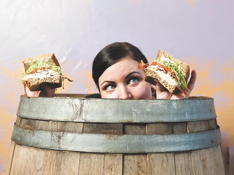 Loretta Haworth with an Unforgettable Nooner sandwich at High Nooner. - STEPHEN SCHLANGE