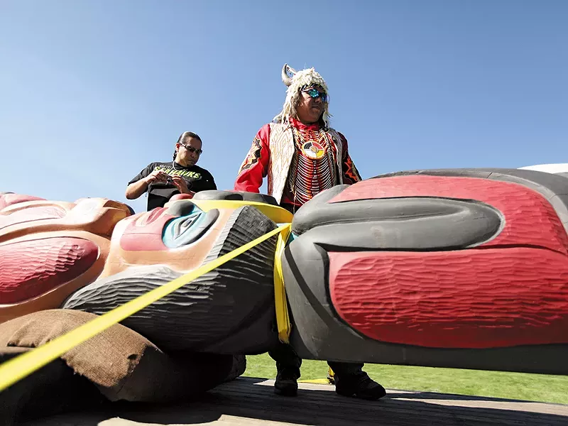 Lummi tribal members, hauling a "healing totem," are driving the route that coal trains would travel. - YOUNG KWAK