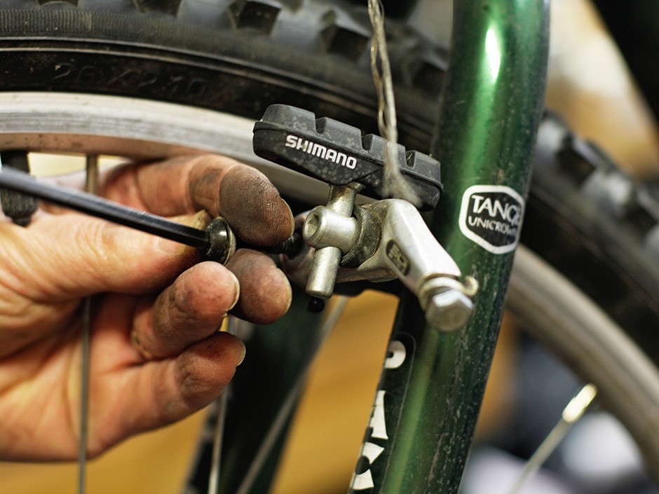 Mechanic Dave Mannino repairs a bicycle at Two Wheel Transit. - YOUNG KWAK
