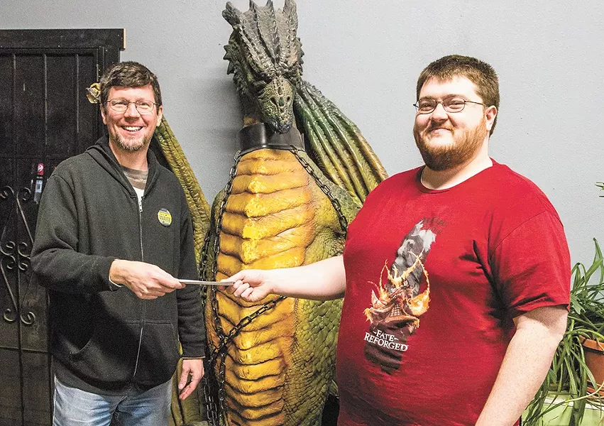 Merlyn's owner John Waite (left) awards Bryan Eleyet the winning ticket to the Magic Pro Tour in Brussels. - ROD JEFFERS
