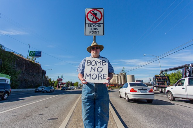 Michael Poulin protests against the threat of bombing Iraq. - MATT WEIGAND