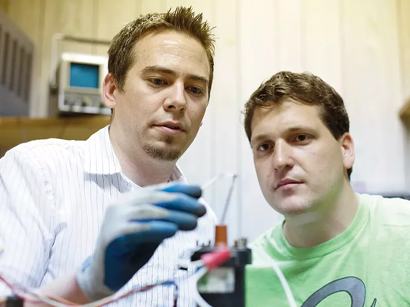 Nate Cutler (left) and Dan McGee work on a spark gap ignitor at Spokane Create! - YOUNG KWAK