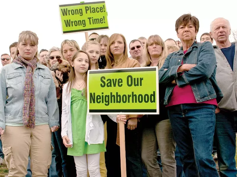 Neighbors who oppose a local church’s plan to build an elderly-housing complex. - AMY HUNTER