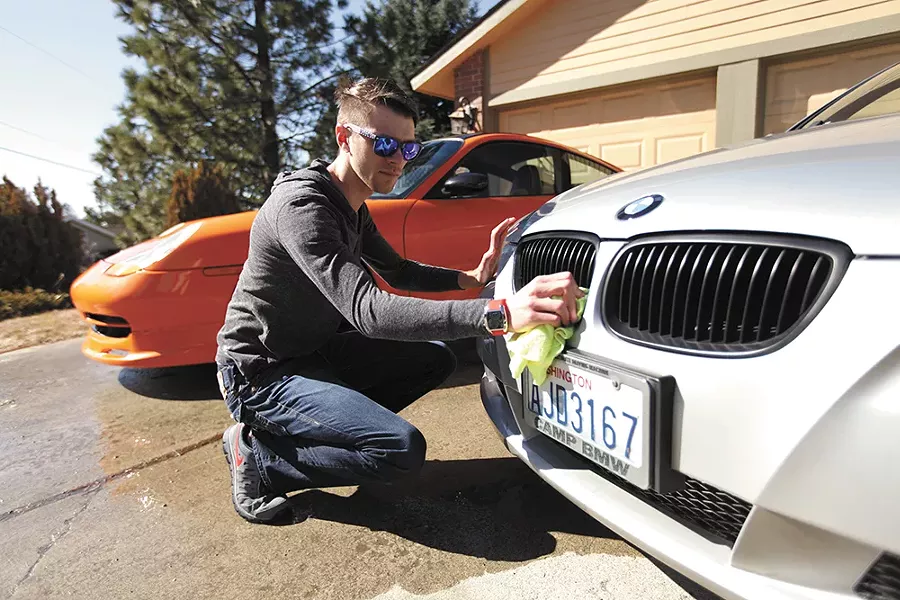 Nicholas Newell, a college student, runs a car detailing business and doesn't plan to sign up for health insurance. - YOUNG KWAK