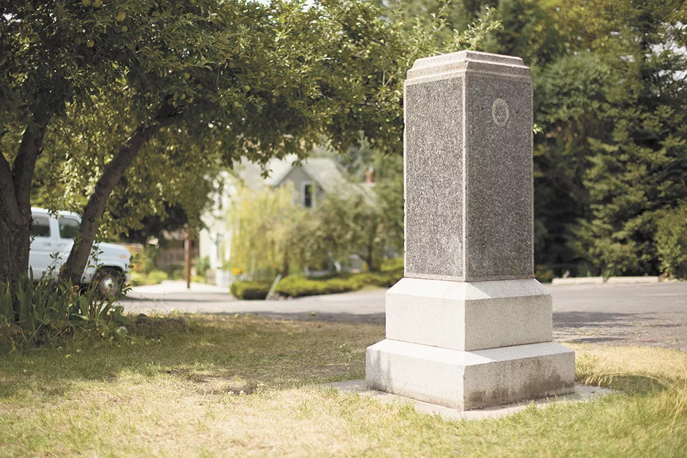 No plaque or sign marks the granite monument that dedicated Glover Field to James N. Glover in 1917. - YOUNG KWAK