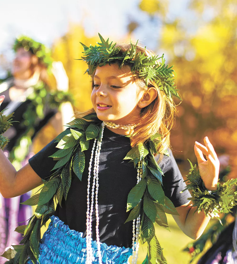 Northwest Hula Company's Maddy Pearson, 8, practices with her dance troupe before the Spokane Fall Folk Festival. - YOUNG KWAK