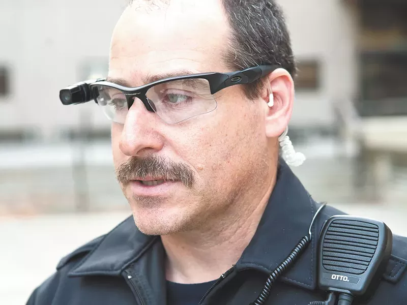 Officer Vic Carroll, wired with the two cameras the department is trying. - STEPHEN SCHLANGE