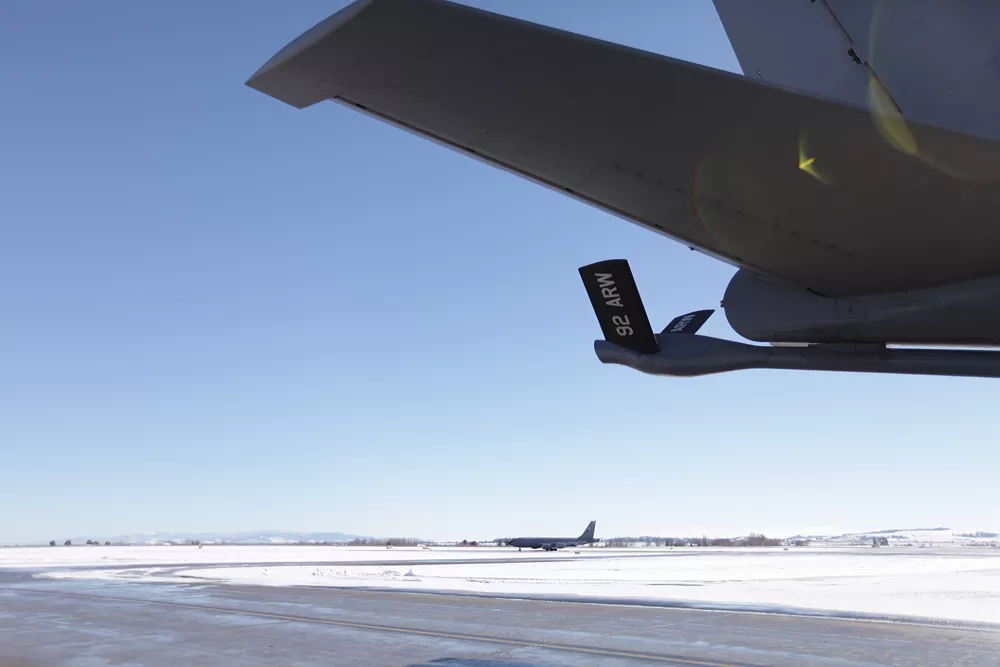 One of the last flights from the Transit Center at Manas, Reach 192, taxis behind an earlier flight back, Reach 181, at Fairchild Air Force Base. - YOUNG KWAK