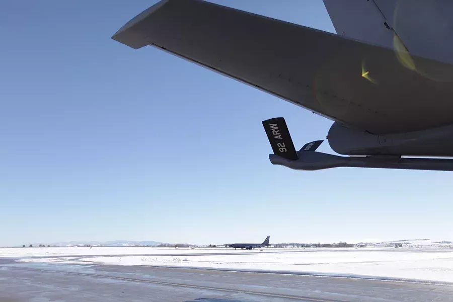 One of the last flights from the Transit Center at Manas, Reach 192, taxis behind an earlier flight back, Reach 181, at Fairchild Air Force Base. - YOUNG KWAK