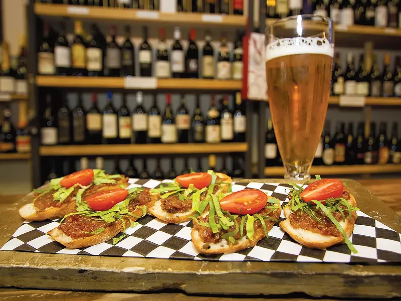 Pair a glass of wine or beer with Vintage Vines\' bacon jam bruschetta. - JOE KONEK