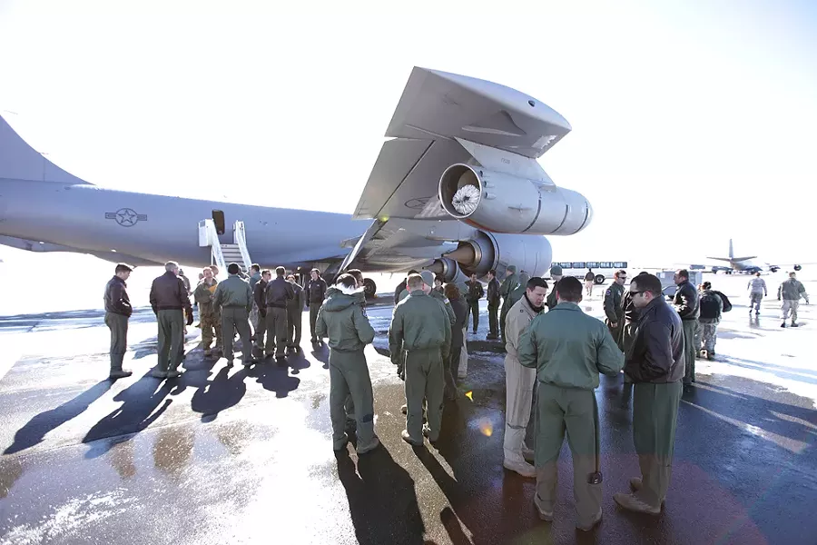 Personnel and family members gather after Reach 192 arrives at Fairchild Air Force Base. - YOUNG KWAK