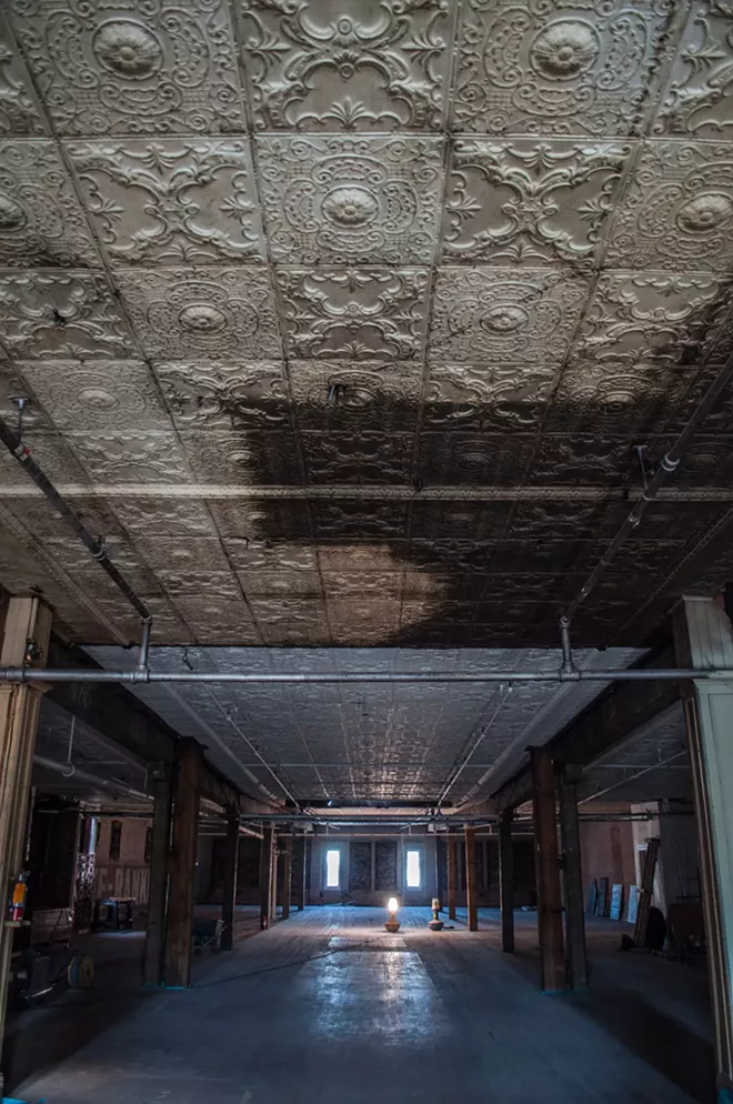 Ongoing renovations call for the tin ceilings to be restored, and the wooden floors on the fourth floor to be refinished. The brick walls with the old grocery store lettering will also remain intact. - SARAH WURTZ