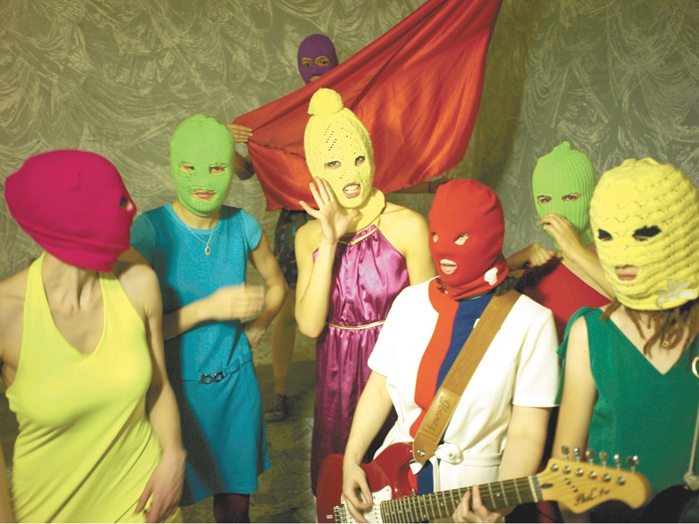 Pussy Riot, in its signature balaclavas