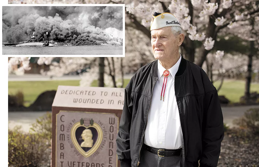 Ray Garland at the Purple Heart Memorial outside the Spokane Veterans Memorial Arena. INSET: The half-sunk, burning - USS Oklahoma on Dec. 7, 1941, just as Garland would have seen it. - YOUNG KWAK