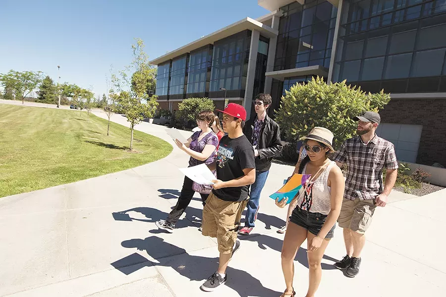 Recent high school graduates participate in a scavenger hunt during a Spokane Public Schools' high-school-to-college-transition event at Spokane Falls Community College. - YOUNG KWAK