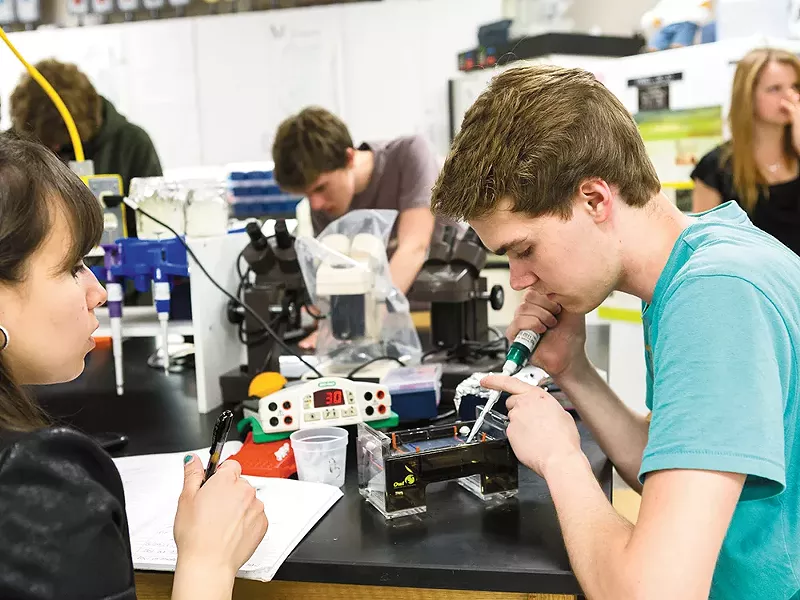 Reyna Lomeli (left) and Tanner Streicher in the science lab at North Central High School. - STEPHEN SCHLANGE