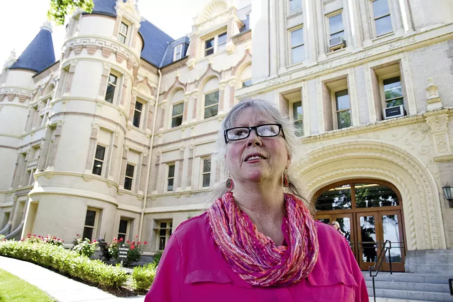Rhoda Behrens, in front of the Spokane County Courthouse, has encountered many legal obstacles to obtaining mental health treatment for her 26-year-old son, Richie Hoisington. - JACOB JONES