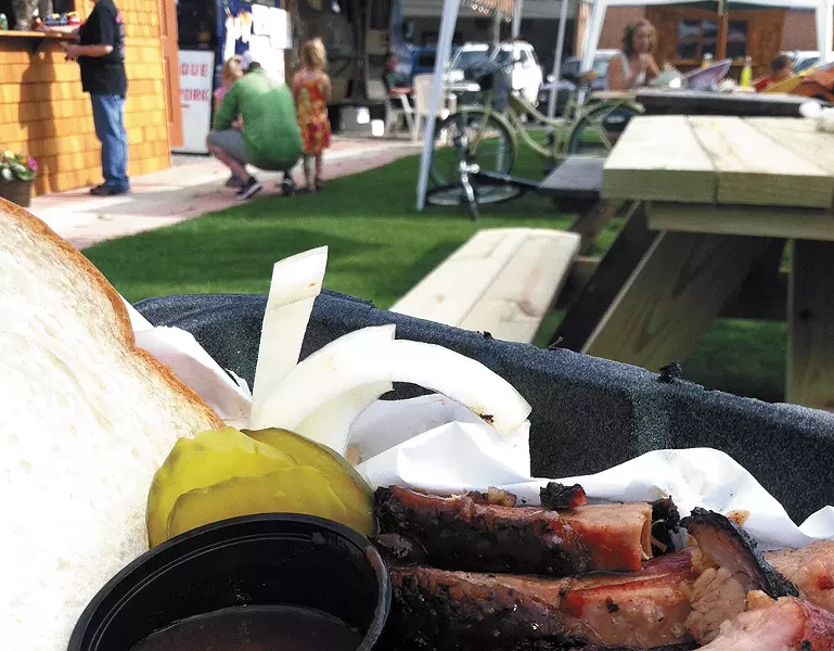 Ribs and brisket from Bad J's, an Oak Street eatery. - CARRIE SCOZZARO