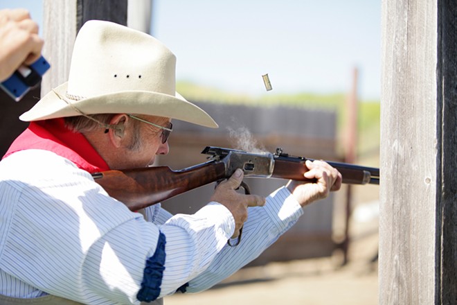 Roger "Hop Along Hoot" Sherman fires his Hartford 92 rifle during a Windy Plains Drifters match in Medical Lake on July 13. - YOUNG KWAK