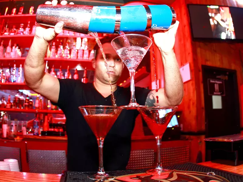 S WAXX co-owner Colin Smith gets fancy behind the bar.