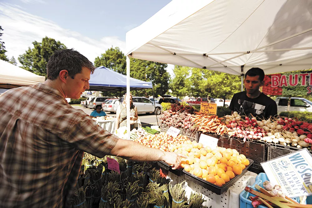 Santé Chef and Owner Jeremy Hansen (this year's winner of Best Chef) shops at the South Perry Farmers Market. - YOUNG KWAK