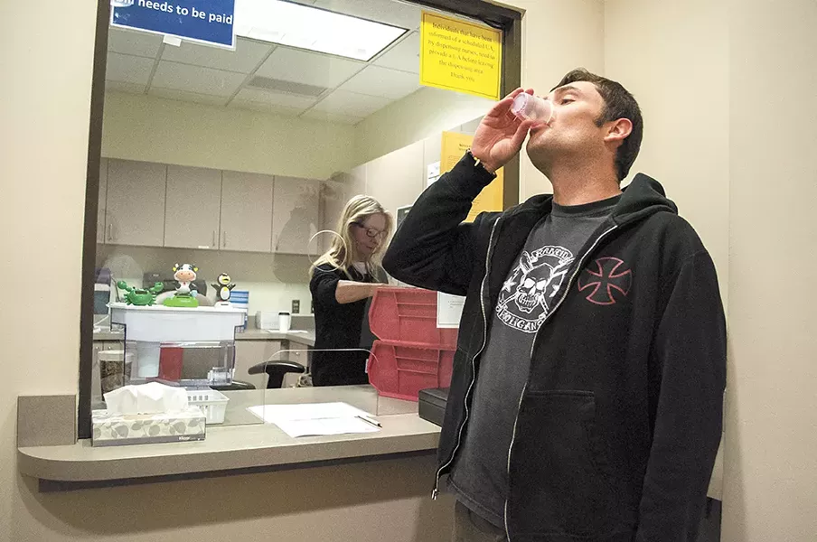 Sean downs his daily dose of methadone at the Spokane Regional Health District. - SARAH WURTZ
