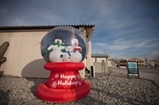 An oversized snow globe sits in front of the A'la Too dining facility at the Transit Center at Manas, Kyrgyzstan. - YOUNG KWAK