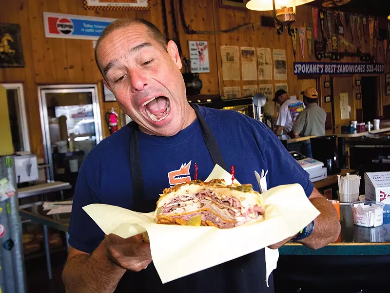 Smacky\'s owner Mike Ackermann with the massive club sandwich. - JOE KONEK