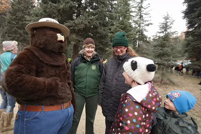 Smokey the Bear, left, hangs out with (left to right) U.S. Forest Service employee Gayne Sears, Chelsea Earls, her 8-year-old daughter Olivia and 5-year-old son Oliver. - YOUNG KWAK
