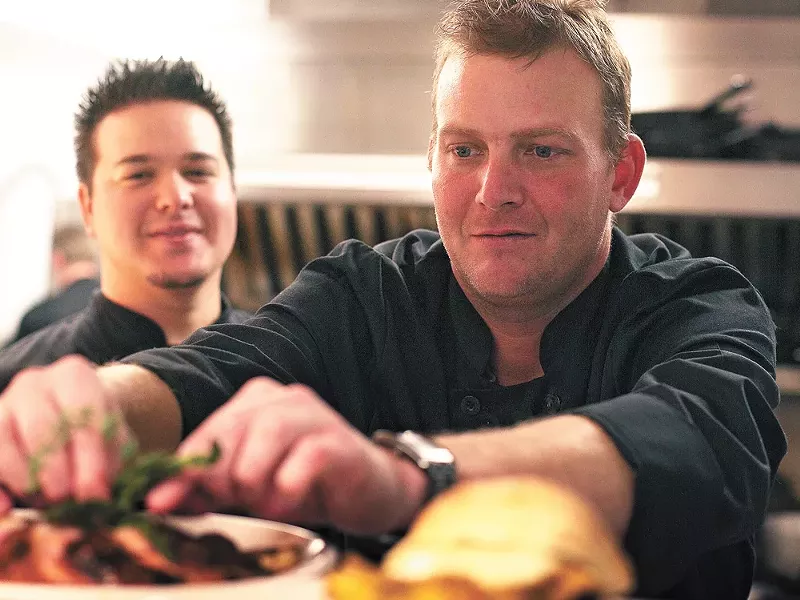 Sous-chef Justin Braviroff, left, looks on as co-owner Jason Rex garnishes the Muscovy duck at Fraiche. - YOUNG KWAK