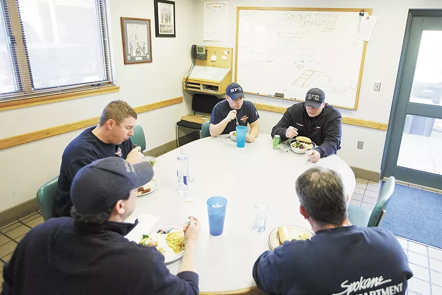 Spokane firefighters gather for a group lunch at Station No. 2. - YOUNG KWAK