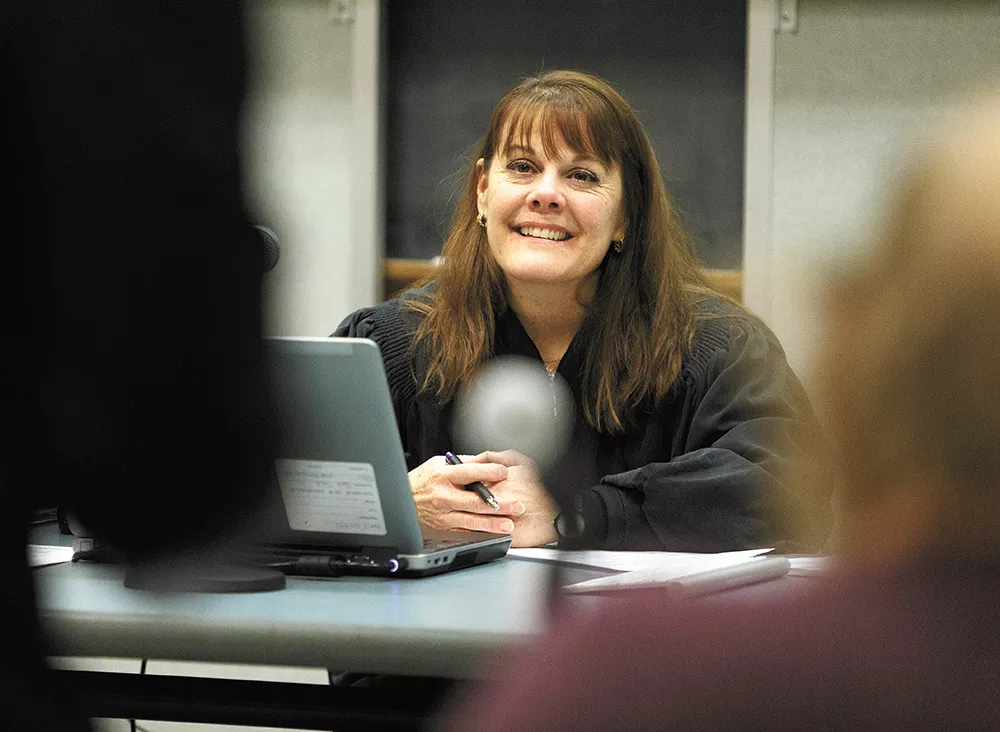 Spokane Municipal Court Judge Mary Logan presides over the new community court, which is held weekly at the downtown library. - YOUNG KWAK