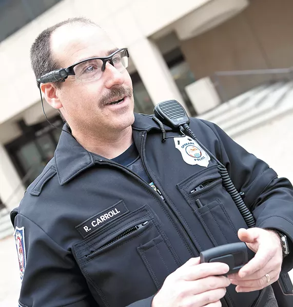 Spokane Police Officer Vic Carroll testing out body cameras. - STEVEN SCHLANGE