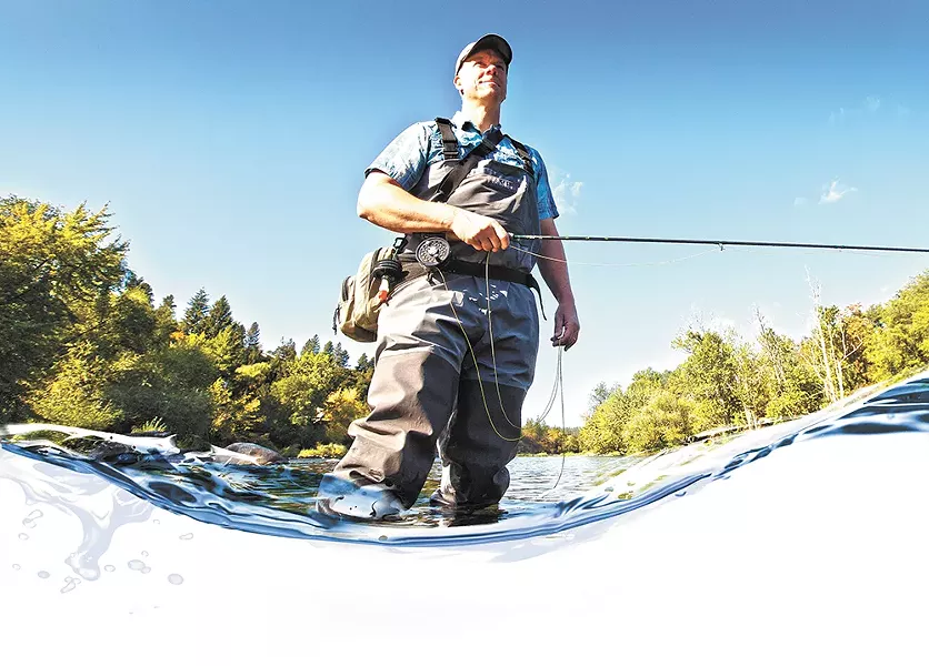 Spokane Riverkeeper Jerry White in the Spokane River in the Peaceful Valley neighborhood. - YOUNG KWAK