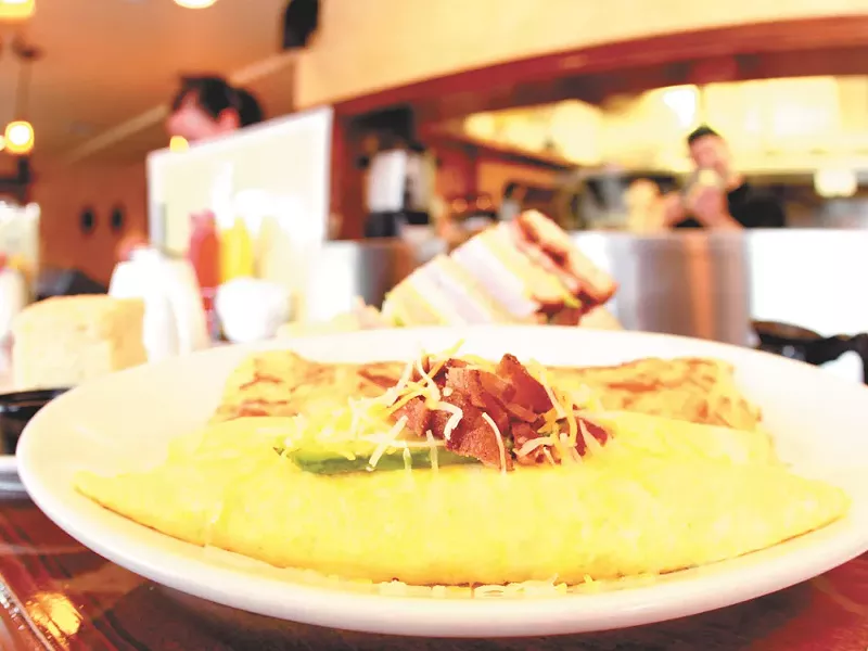 The bacon avacado omelet at Dolly’s is just one of the breakfast options at the popular Spokane eatery. - JOE KONEK