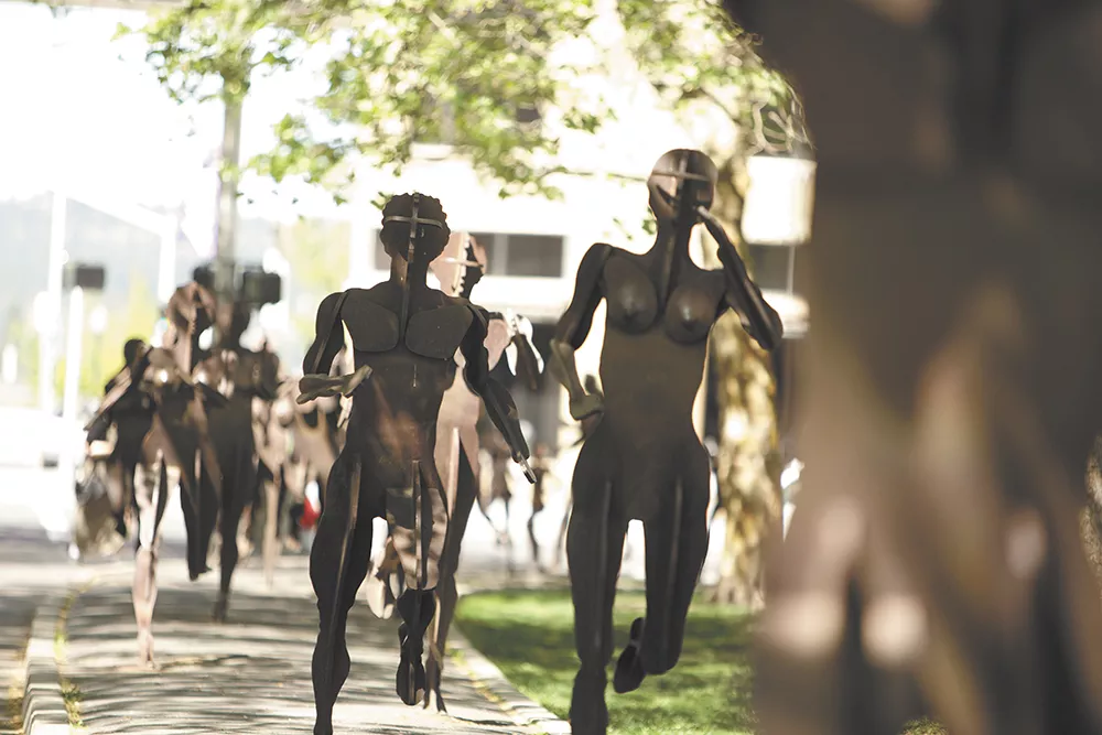The Joy of Running Together by artist David Govedare stretches down Spokane Falls Boulevard in downtown Spokane
