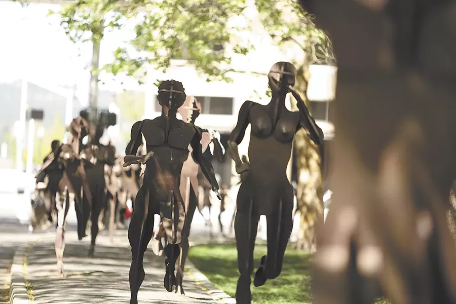The Joy of Running Together by artist David Govedare stretches down Spokane Falls Boulevard in downtown Spokane