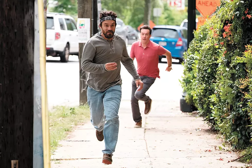 Ed Helms (chasing Jake Johnson) plays "Hoagie" in TAG. "It's just such a sweet premise," Helms told People magazine. "It's one of those stories you can only turn into a movie because it's real."
