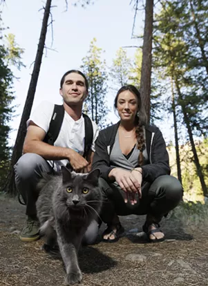 Brendan Love and Ryann Ensrud with Fisher. - YOUNG KWAK