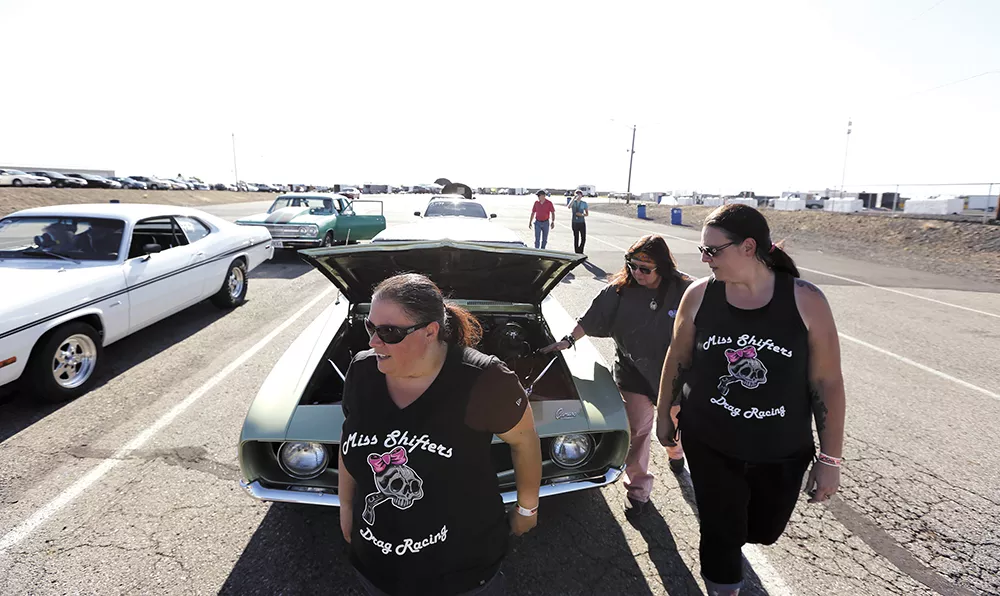 FROM LEFT: Miss Shifters members Shelly Walsh, Annette Callesto and Heather Eller before a Powder Puff time trial, during the Summit #6 Sugar Bear Memorial at the Spokane County Raceway. - YOUNG KWAK
