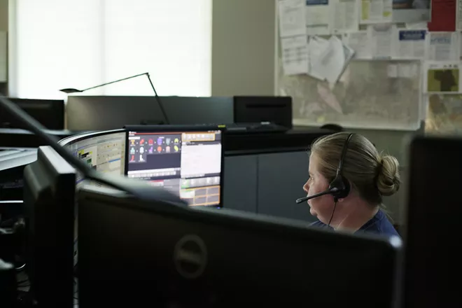 Spokane Fire Department Fire Communications Specialist Cassidy Haas works on a call at the Spokane Fire Department Combined Communications Building in Spokane. - YOUNG KWAK