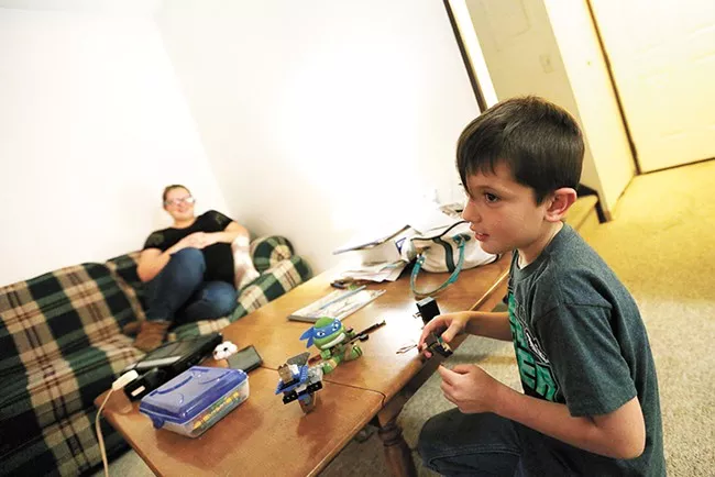 An initiative to house homeless families in Spokane helped Jordan, pictured here last year, find a home - YOUNG KWAK PHOTO