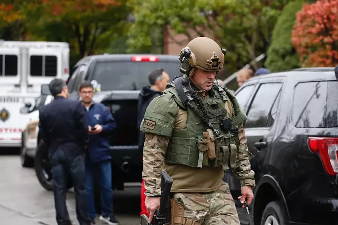 Law enforcement personnel at the scene of a mass shooting at the Tree of Life Synagogue in Pittsburgh, Oct. 27, 2018. Police reported that there were multiple casualties, and that a suspect was in custody. - JARED WICKERHAM/THE NEW YORK TIMES