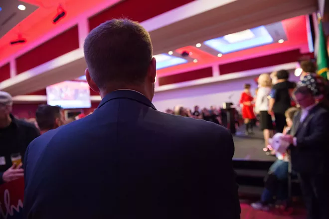 Cathy McMorris Rodgers' campaign manager Patrick Bell watches McMorris Rodgers' victory speech. - DANIEL WALTERS PHOTO