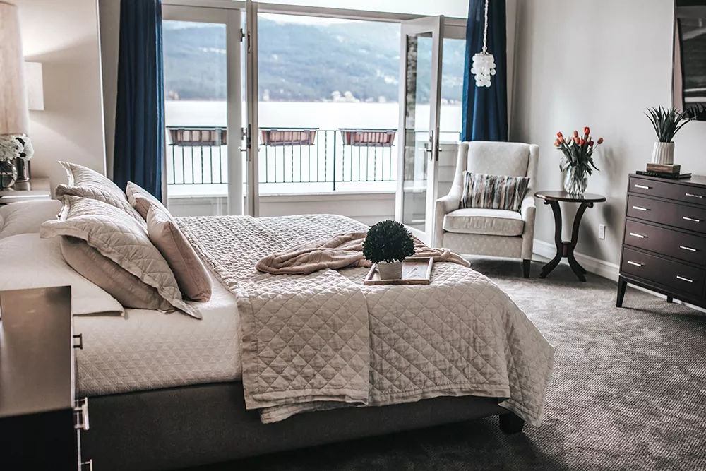 The Wozow master suite features soft colors, with an occasional pop of blue to complement, but not compete with, the sweeping Liberty Lake view. - ALICIA HAUFF PHOTO