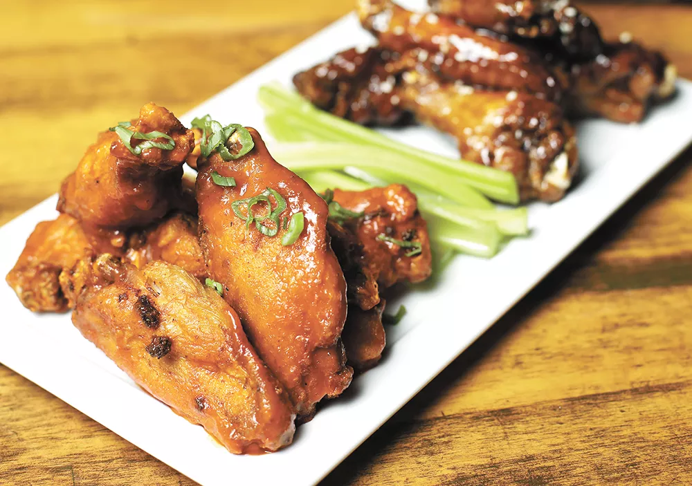 Wings can be coated in a range of tasty sauces at the Viking pub, which offers special pricing on Mondays. - YOUNG KWAK