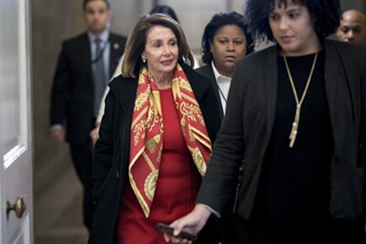 House Speaker Nancy Pelosi (D-Calif.) walks to her office on Capitol Hill in Washington, Jan. 23, 2019. The tit-for-tat between President Donald Trump and Pelosi over the State of the Union address escalated sharply on Wednesday, with Trump telling Pelosi he would deliver the speech in the Capitol on Tuesday as originally scheduled, and Pelosi firing back that he was not welcome unless the government was fully open. - ERIN SCHAFF/THE NEW YORK TIMES